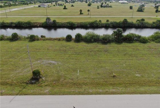 An aerial view of a vacant parcel of land located at 4102 NW 39th Ln